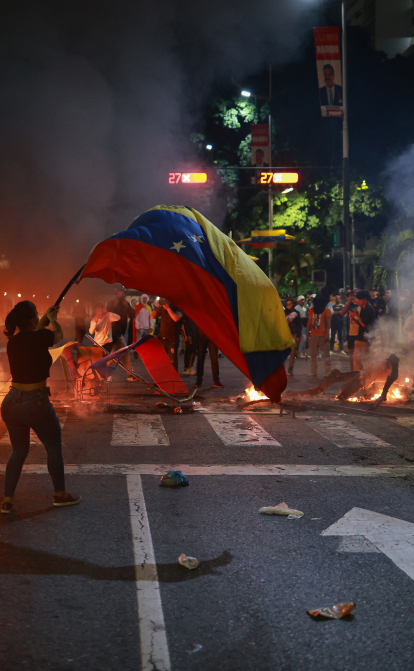 У Венесуелі спалахнули масові протести після оголошення перемоги Ніколаса Мадуро на виборах президента /Getty Images