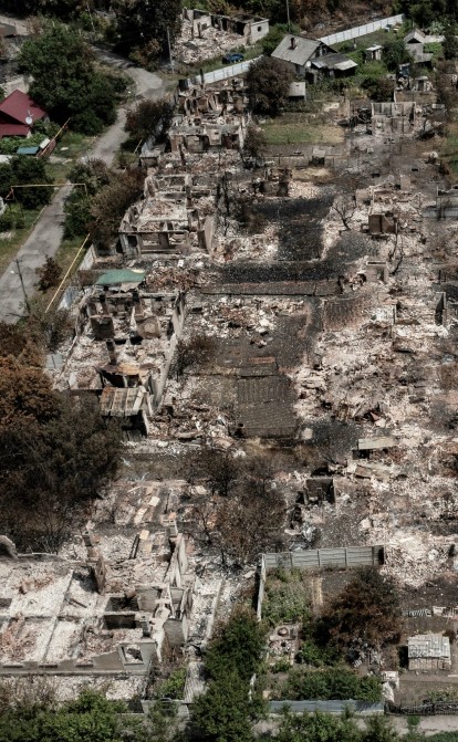 Зруйнований вщент квартал у містечку Привілля, яке розташоване за кілька кілометрів від Лисичанська та Сєвєродонецька /Getty Images