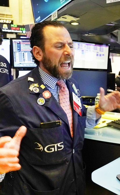 Біткоїн уперше потрапив до фонду на Нью-Йоркській біржі. Криптовалюта побила ціновий рекорд, інвестори вже чекають великих угод /Фото Getty Images