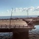 Российский Минтранс сообщил, что на Крымском мосту повреждено дорожное полотно, а конструкции пролетов остаются на своих опорах. /Getty Images