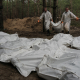 Ексгумація тіл із масового поховання в Ізюмі. 16 вересня 2022 року /Getty Images